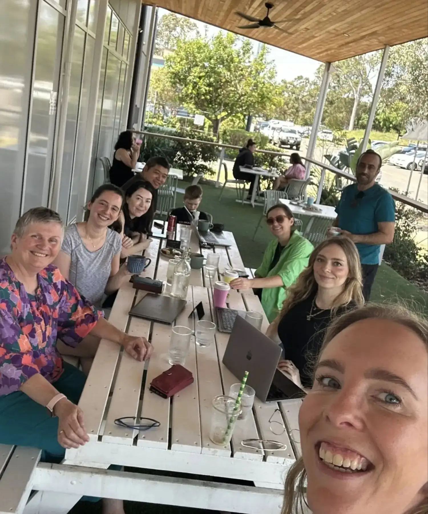 A community led environment happy people of all ages around table